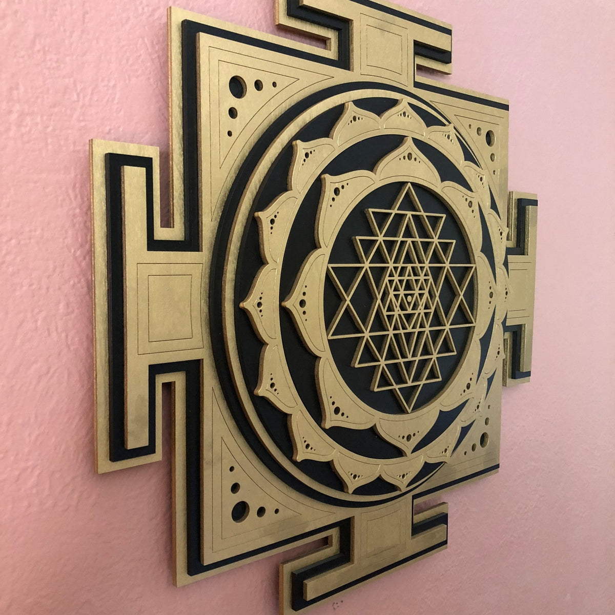 Angled view of an eight layer Divine Sri Yantra showing dimensional construction and shadows