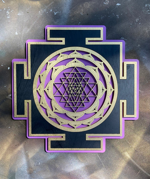 Purple Sri Yantra with pale lotus outlines on a black square base