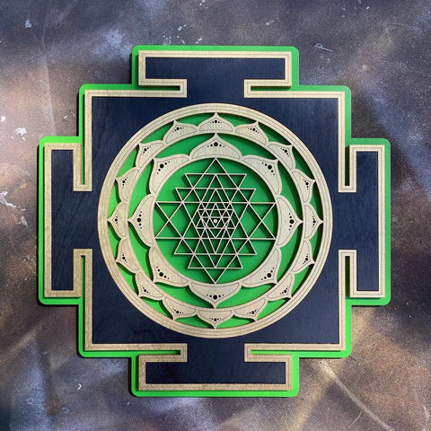 Green and gold Sri Yantra wall art centered on a black square base