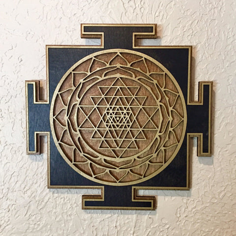 Black and brown Sri Yantra with layered circular geometry